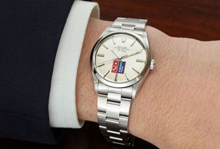 The Story Behind the strange Domino’s Pizza Rolex