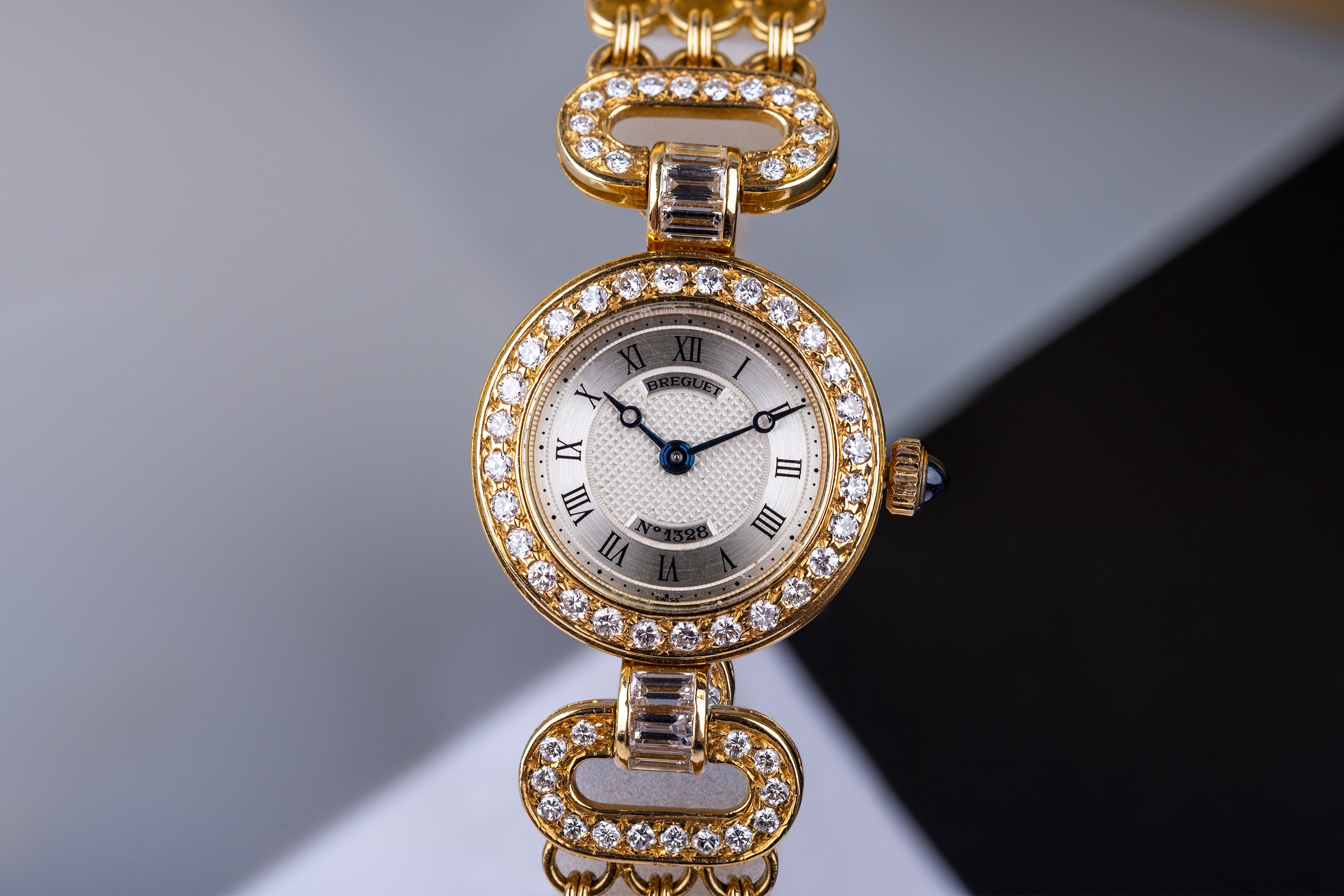 Breguet Ladies Wristwatch Circa 1990's | Silver Dial | Baguette Diamonds | 18k Yellow Gold | Diamond Bezel, Shoulders & Bracelet