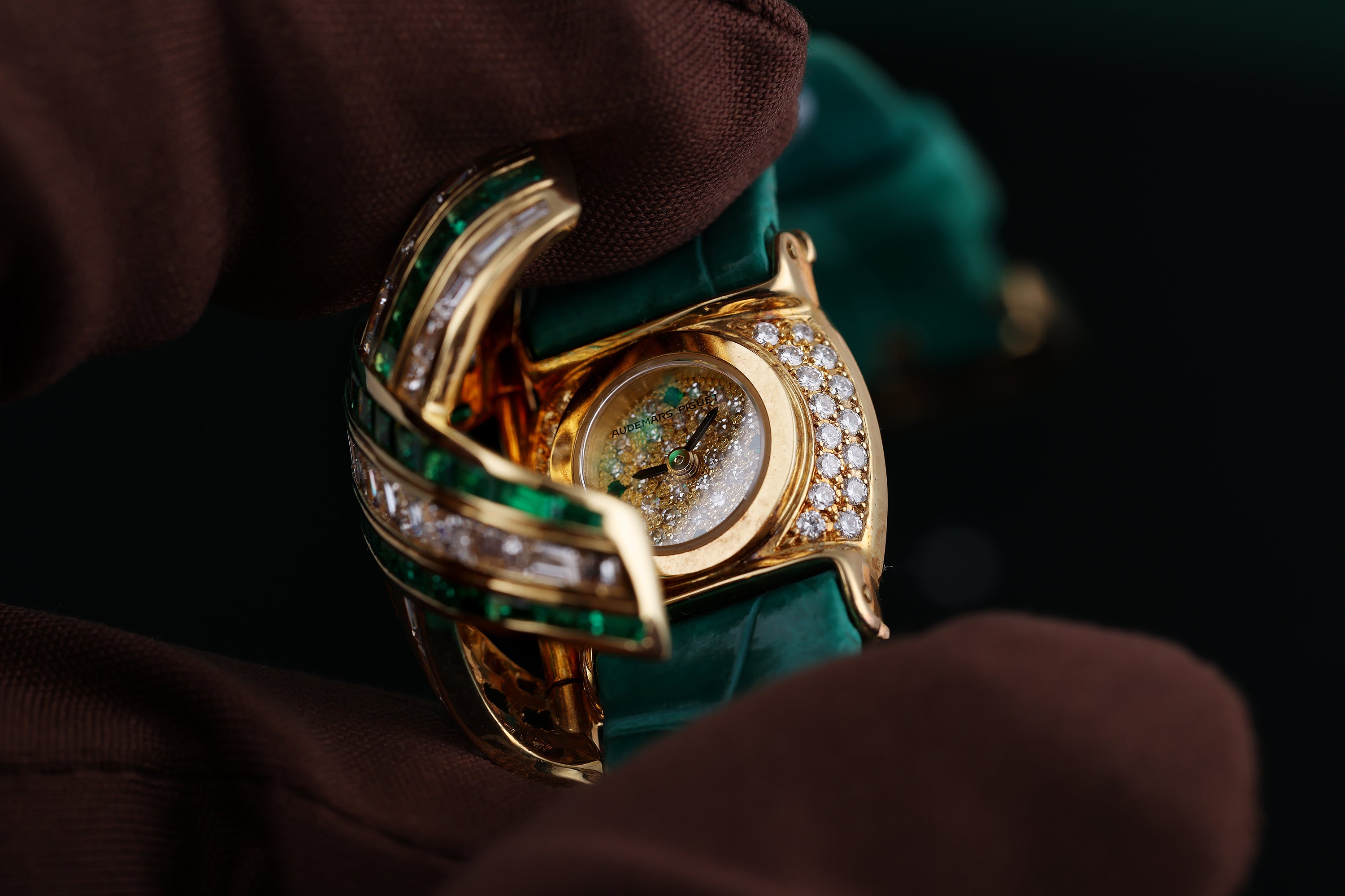 Audemars Piguet Ladies Wristwatch | REF. 67057/BA/E/0132 / 01 | Pave Diamond Dial, Emerald Hours | Emerald & Diamond 'X' Case | 18k Yellow Gold | Circa 1990's