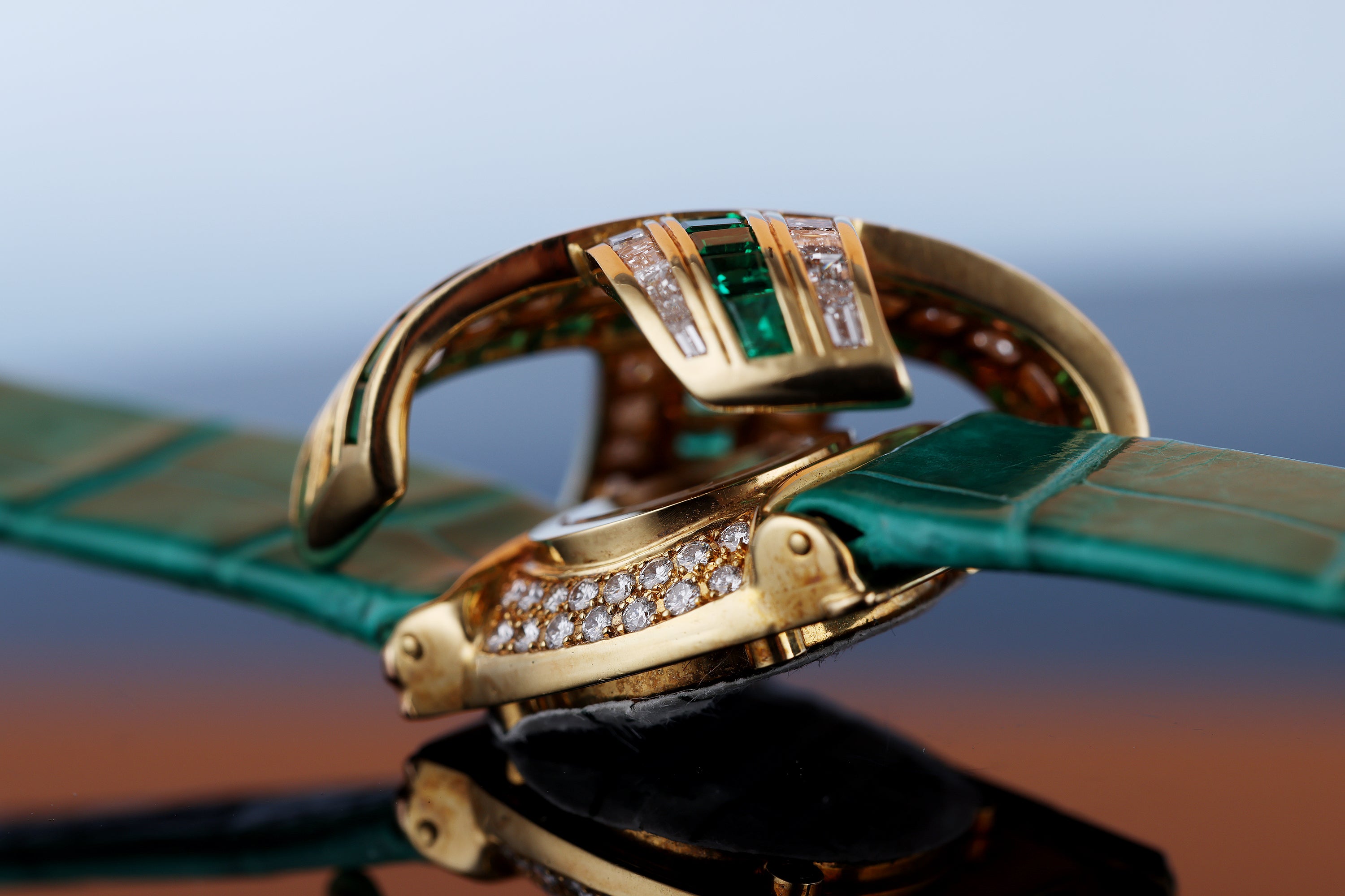 Audemars Piguet Ladies Wristwatch | REF. 67057/BA/E/0132 / 01 | Pave Diamond Dial, Emerald Hours | Emerald & Diamond 'X' Case | 18k Yellow Gold | Circa 1990's