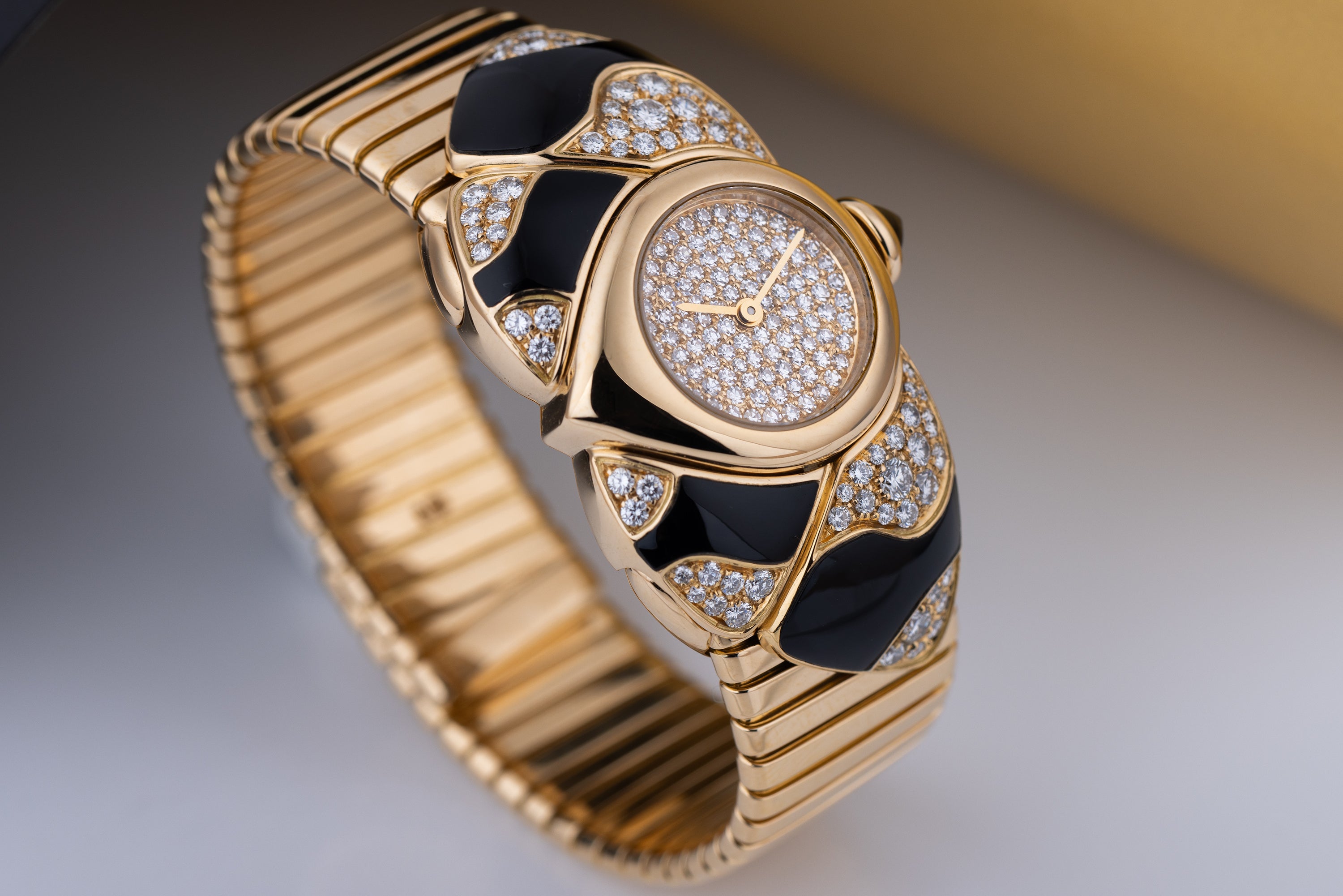 Unworn Vintage Bvlgari Farfalla Watch Bangle | REF. BJ 04 | Pave Diamond Dial | Onyx & Diamond Shoulders | 18k Yellow Gold | Circa 1990's
