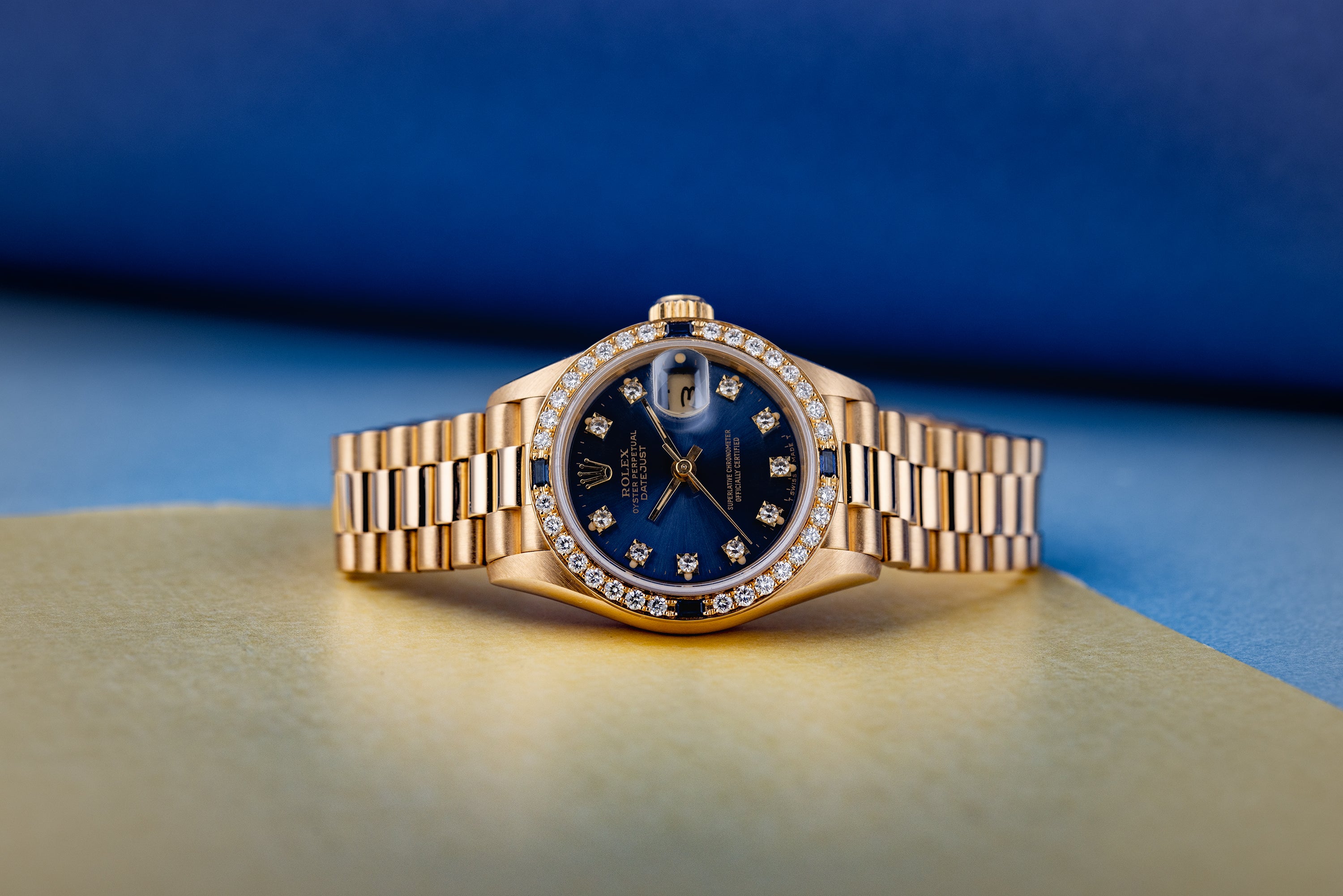 Rolex Lady DateJust | REF. 69088 | Blue Diamond Dial | Diamond & Sapphire Bezel | 18K Yellow Gold