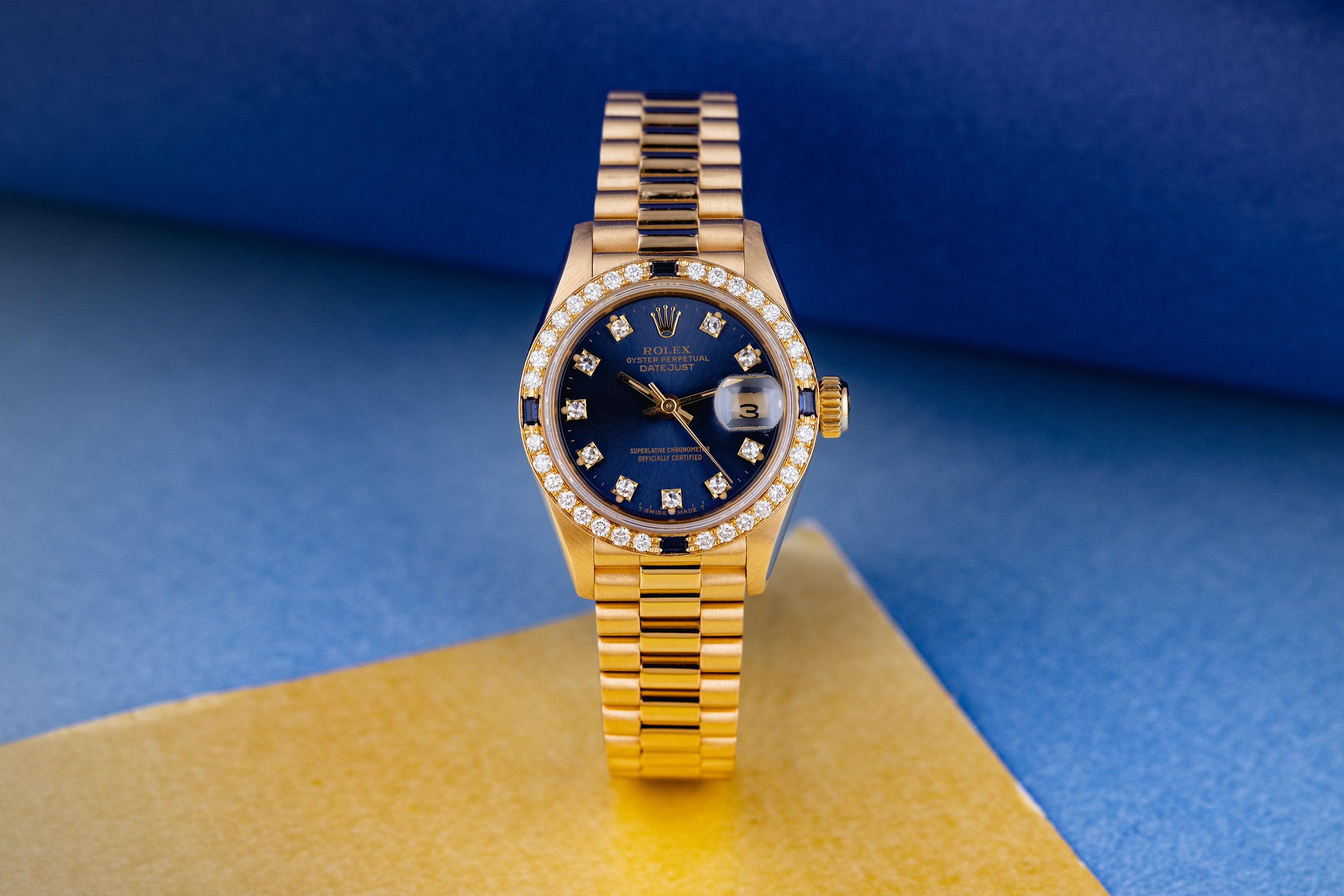 Rolex Lady DateJust | REF. 69088 | Blue Diamond Dial | Diamond & Sapphire Bezel | 18K Yellow Gold