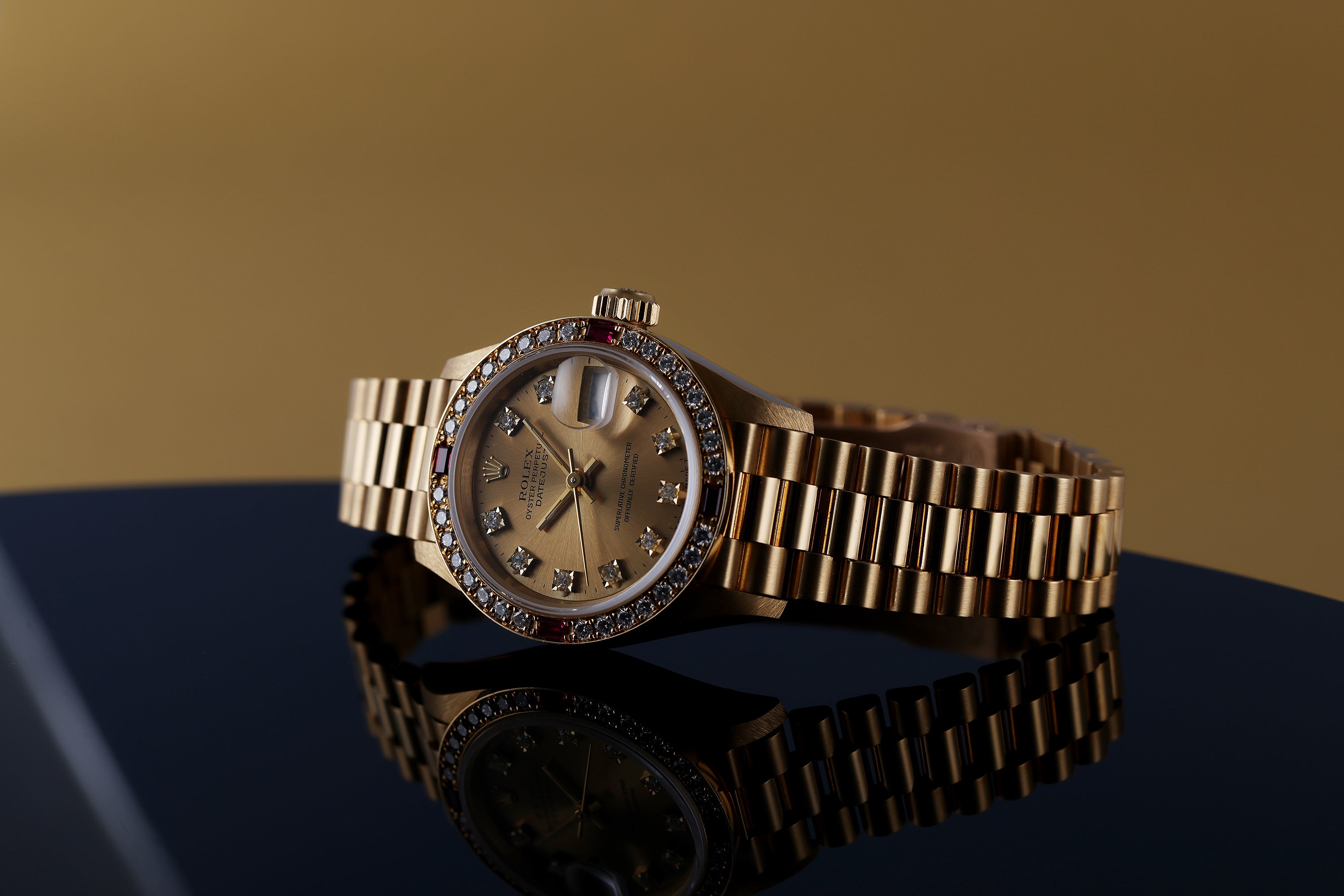 NOS: Rolex Lady DateJust | Diamond & Ruby Dial Bezel | 18k Yellow Gold | 69068 | Unpolished