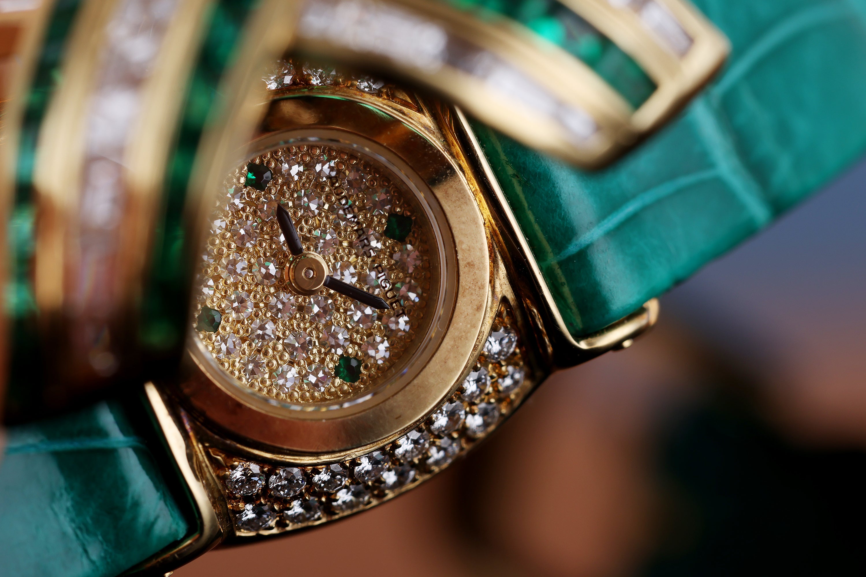 Audemars Piguet Ladies Wristwatch | REF. 67057/BA/E/0132 / 01 | Pave Diamond Dial, Emerald Hours | Emerald & Diamond 'X' Case | 18k Yellow Gold | Circa 1990's