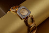 Boucheron Vintage Lady's Wristwatch | Circa 1970s | Champagne Dial | Double Row Diamond Bezel | 18k Yellow Gold