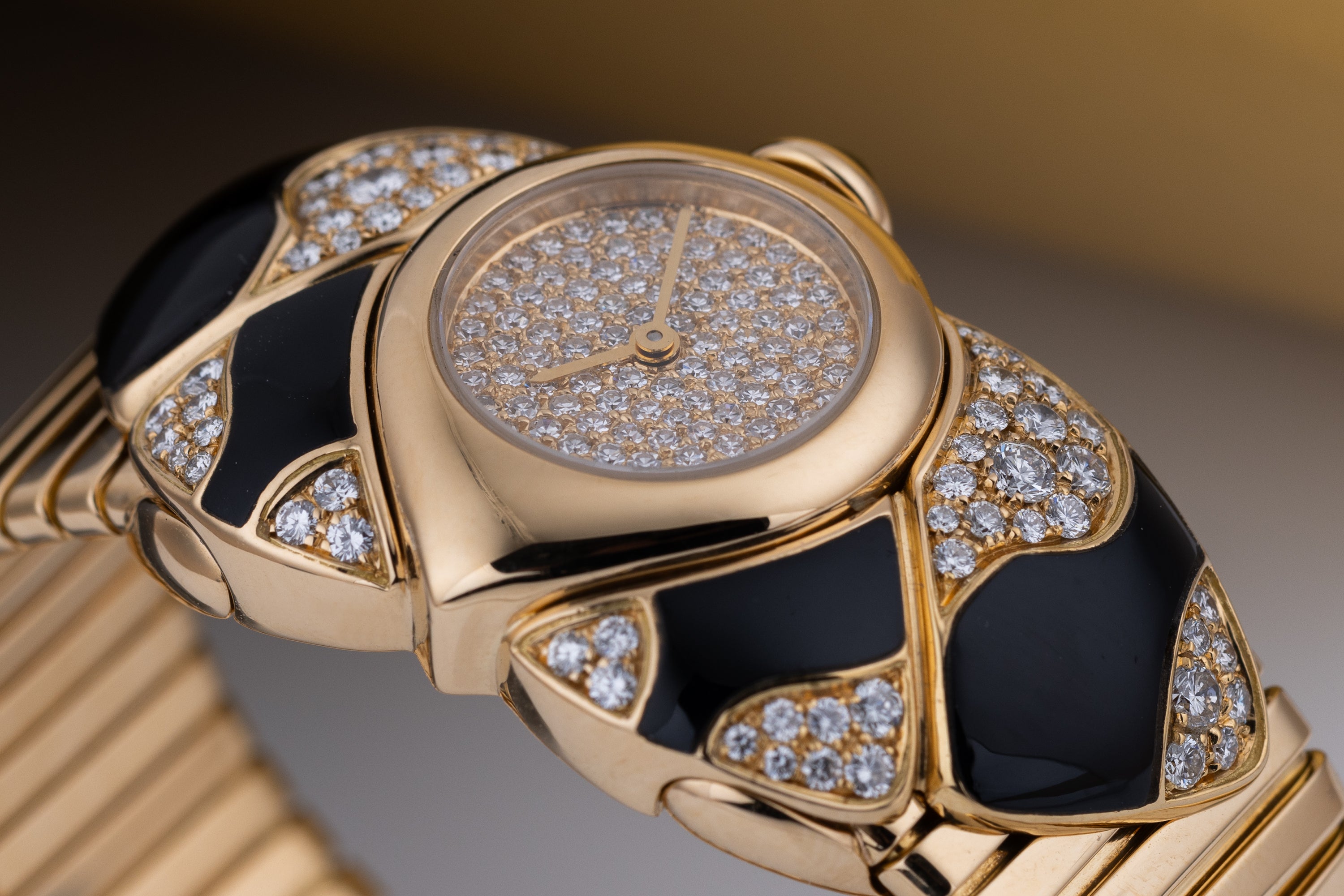 Unworn Vintage Bvlgari Farfalla Watch Bangle | REF. BJ 04 | Pave Diamond Dial | Onyx & Diamond Shoulders | 18k Yellow Gold | Circa 1990's