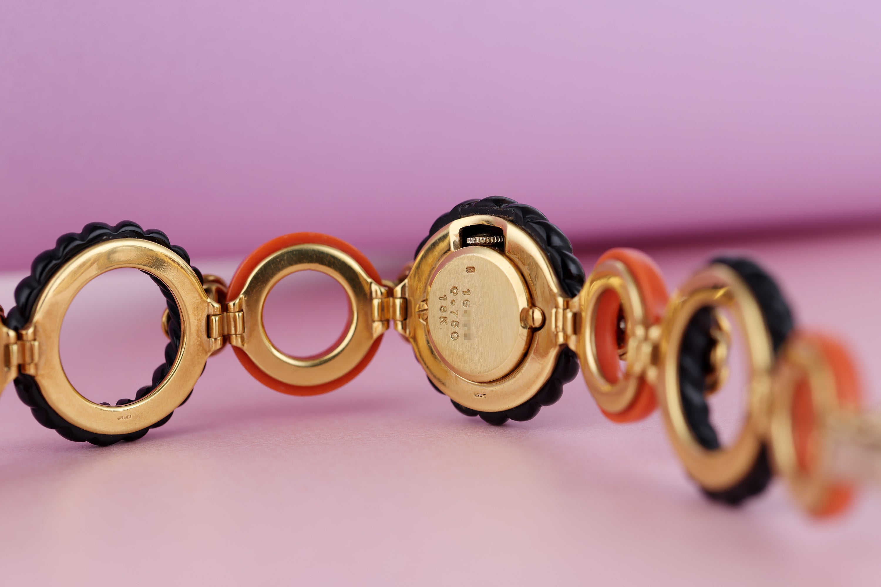 DeLaneau Ladies Wristwatch | Coral & Onyx | 18k Yellow Gold | Diamond Setting | Circa 1970s