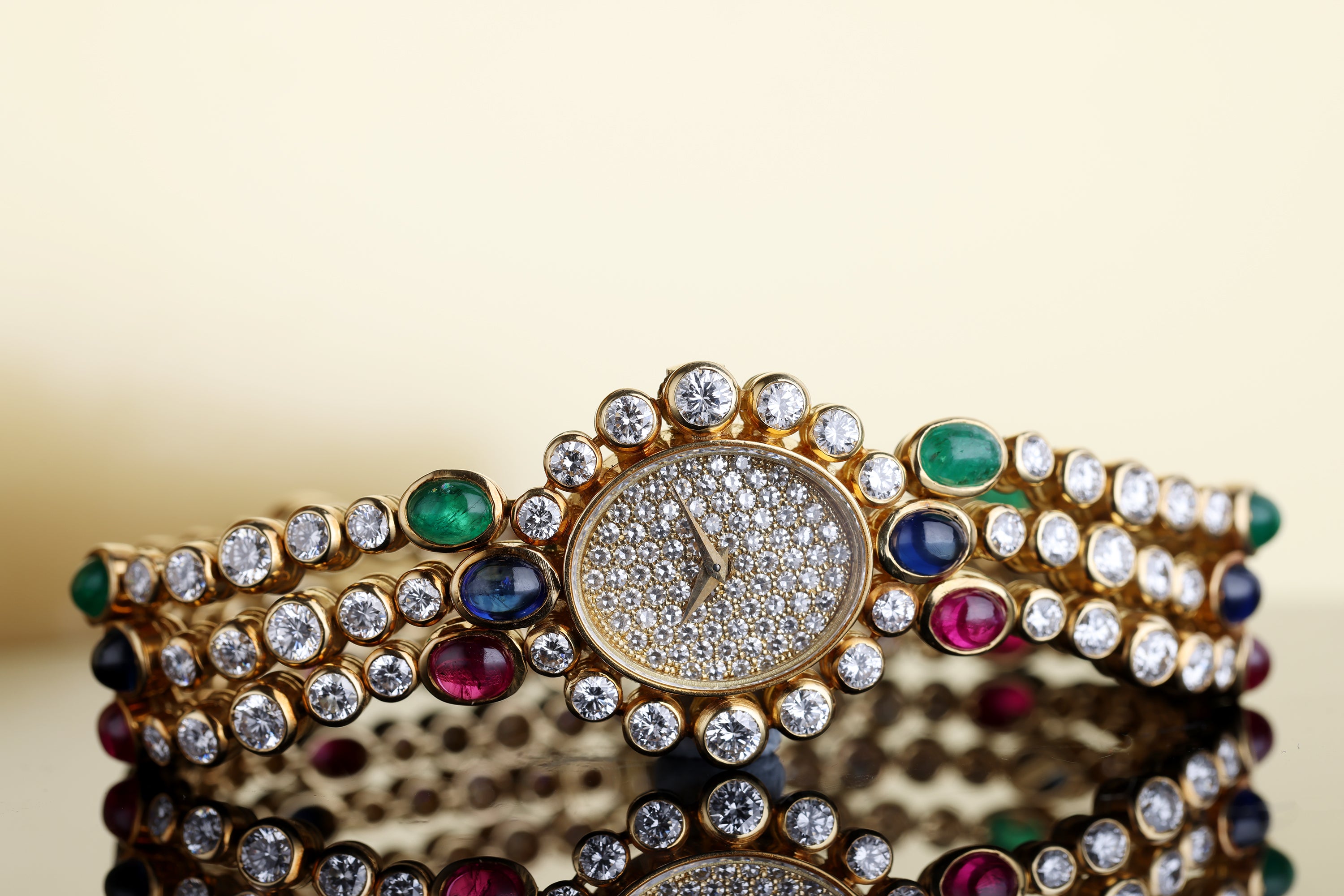 DeLaneau 1990's Ladies Wristwatch | Pavé Diamonds & Multi Gemstones | Ruby, Emerald & Sapphire Cabochons | 18k Yellow Gold