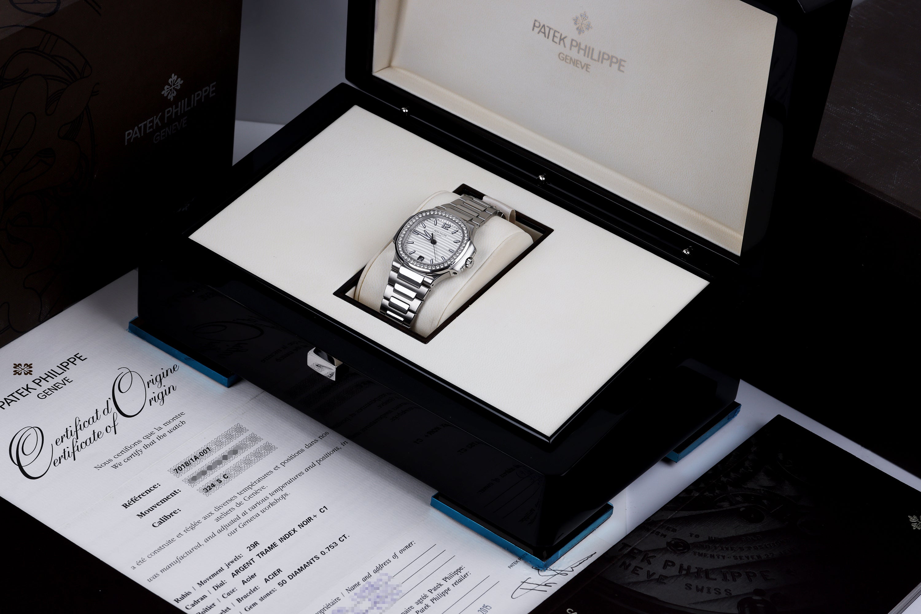 Patek Philippe Nautilus Ladies Automatic | REF. 7018/1A-001 | Silver Dial | 33mm | Stainless Steel | Box & Papers | 2015