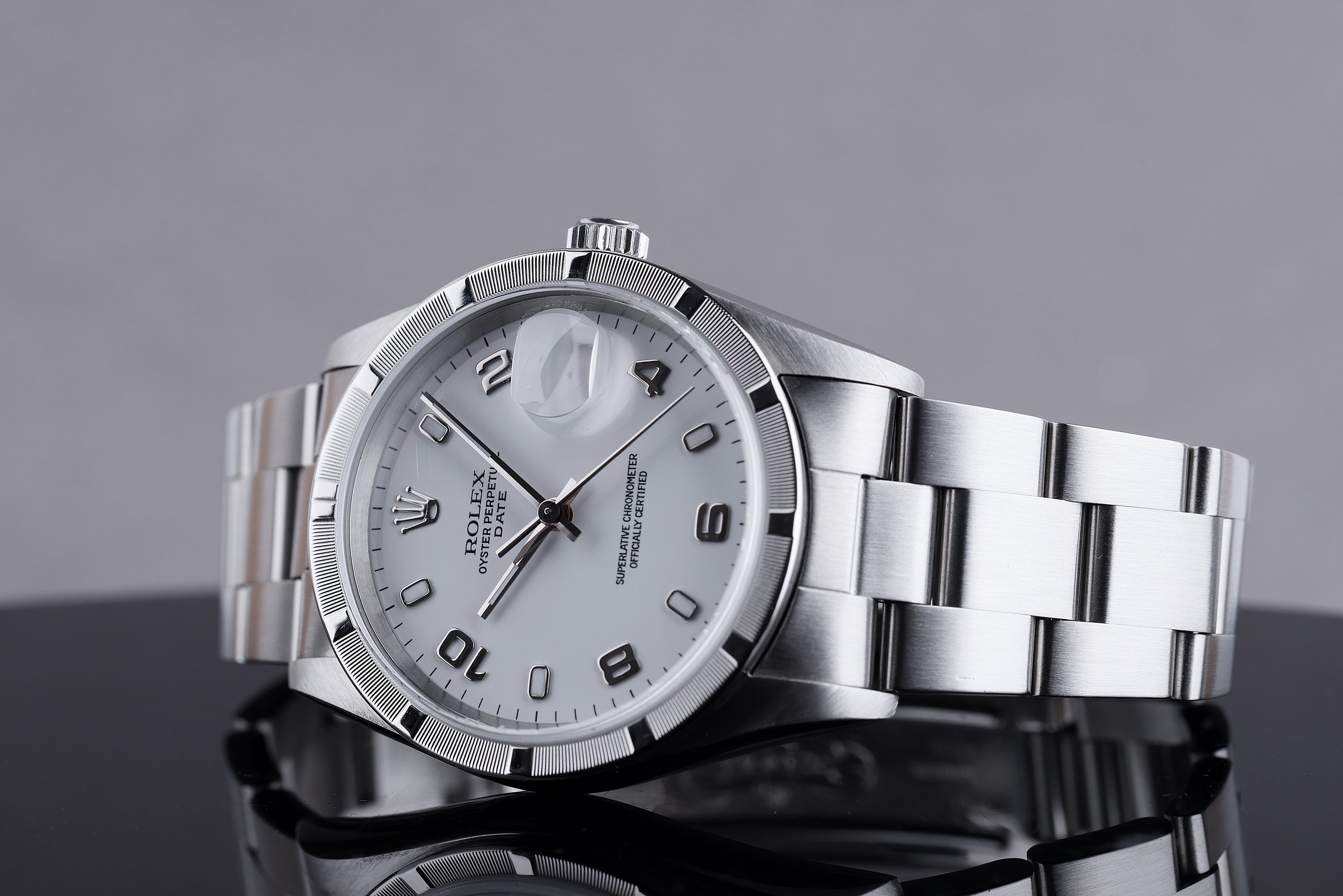 Rolex Date 34mm | REF. 15210 | White Dial | Engine Turned Bezel | Stainless Steel | 2001